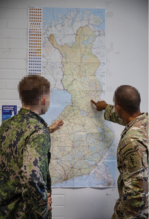 Two men in camouflage are pointing at a map on a wall. AI generated content