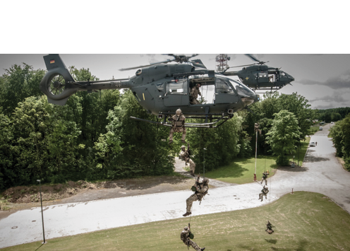A group of soldiers are being lifted by a helicopter. AI generated content