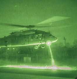 A green helicopter with a large rotor is flying in the air. AI generated content
