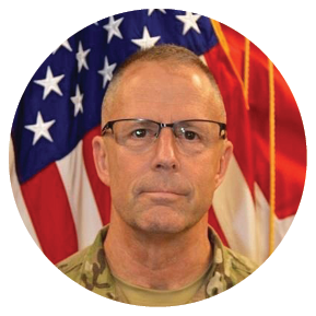 A man in a military uniform stands in front of an American flag. AI generated content