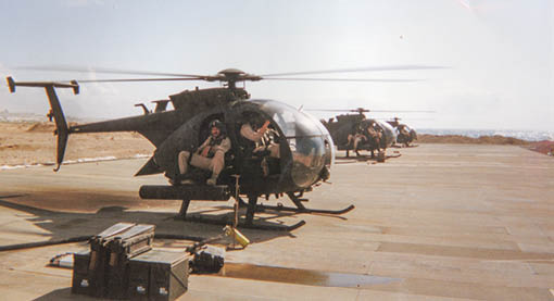 A helicopter with a man in a seat. Description generated by AI