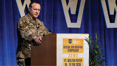 A man in a military uniform is giving a speech at a podium. Description generated by AI