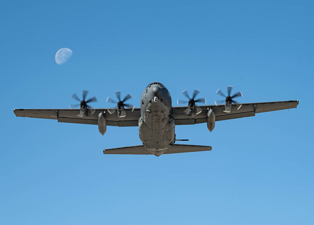 A large airplane with propellers flying in the sky. Description generated by AI