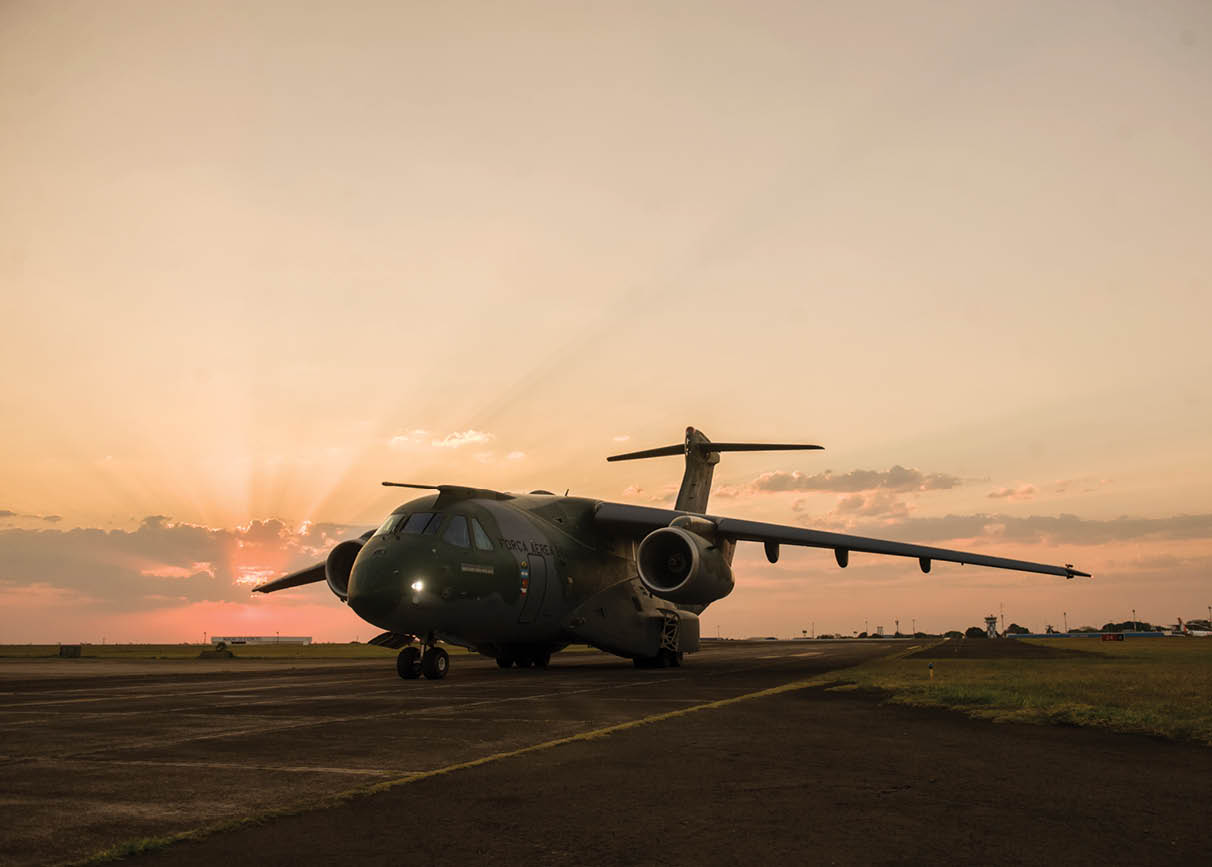 A large airplane with a propeller on the runway. Description generated by AI