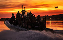 A group of people on a boat. Description generated by AI