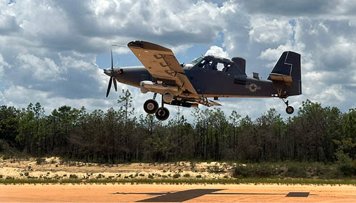 A small airplane is flying in the air. Description generated by AI