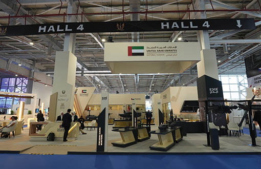 A large room with a sign that says Hall 4. Description generated by AI