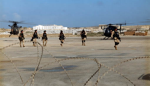 A group of men in uniforms walking on a tarmac. Description generated by AI