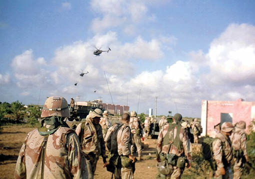 A group of soldiers are standing in a field. Description generated by AI