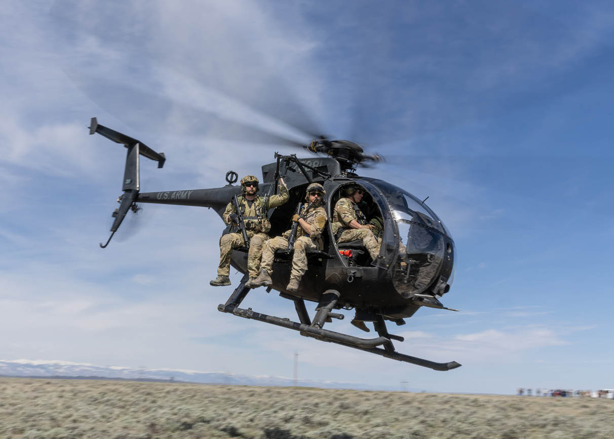 A helicopter with two people in it. Description generated by AI