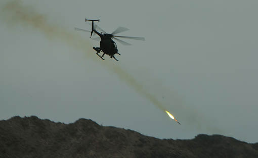A helicopter is flying in the sky and shooting a missile. Description generated by AI