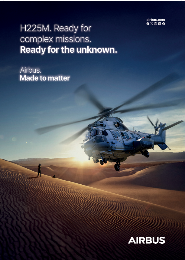 A helicopter is flying over a desert. Description generated by AI