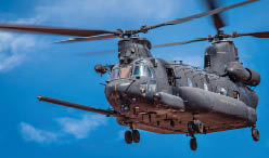 A helicopter with two blades on top. Description generated by AI