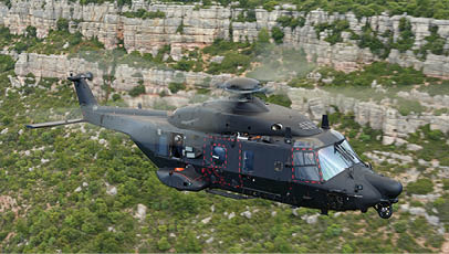 A helicopter flying in the air. Description generated by AI
