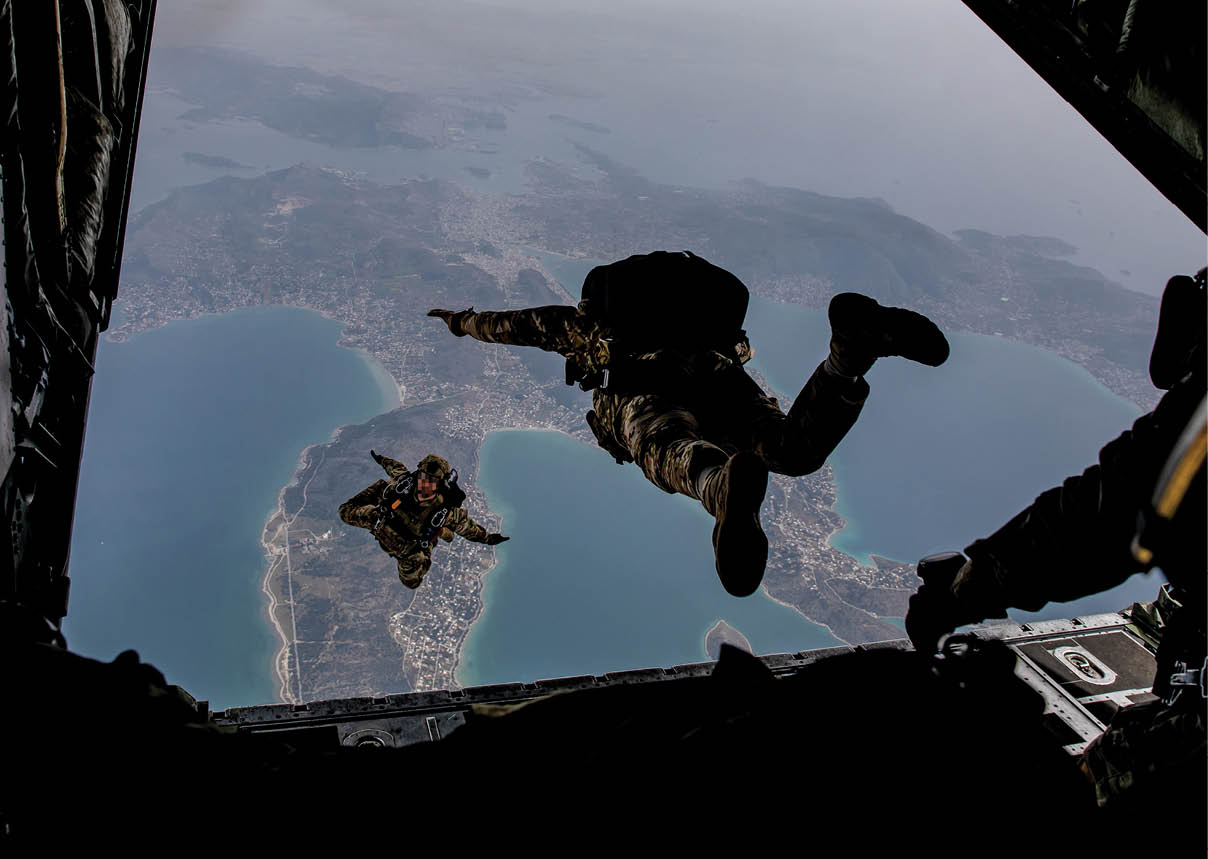 A man is skydiving over the ocean. Description generated by AI