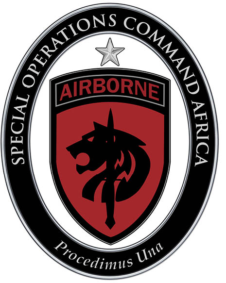 A close-up of a military patch with the word AIRBORNE in red on a black background, surrounded by a circular border with the text SPECIAL OPERATIONS COMMAND AFR. Description generated by AI