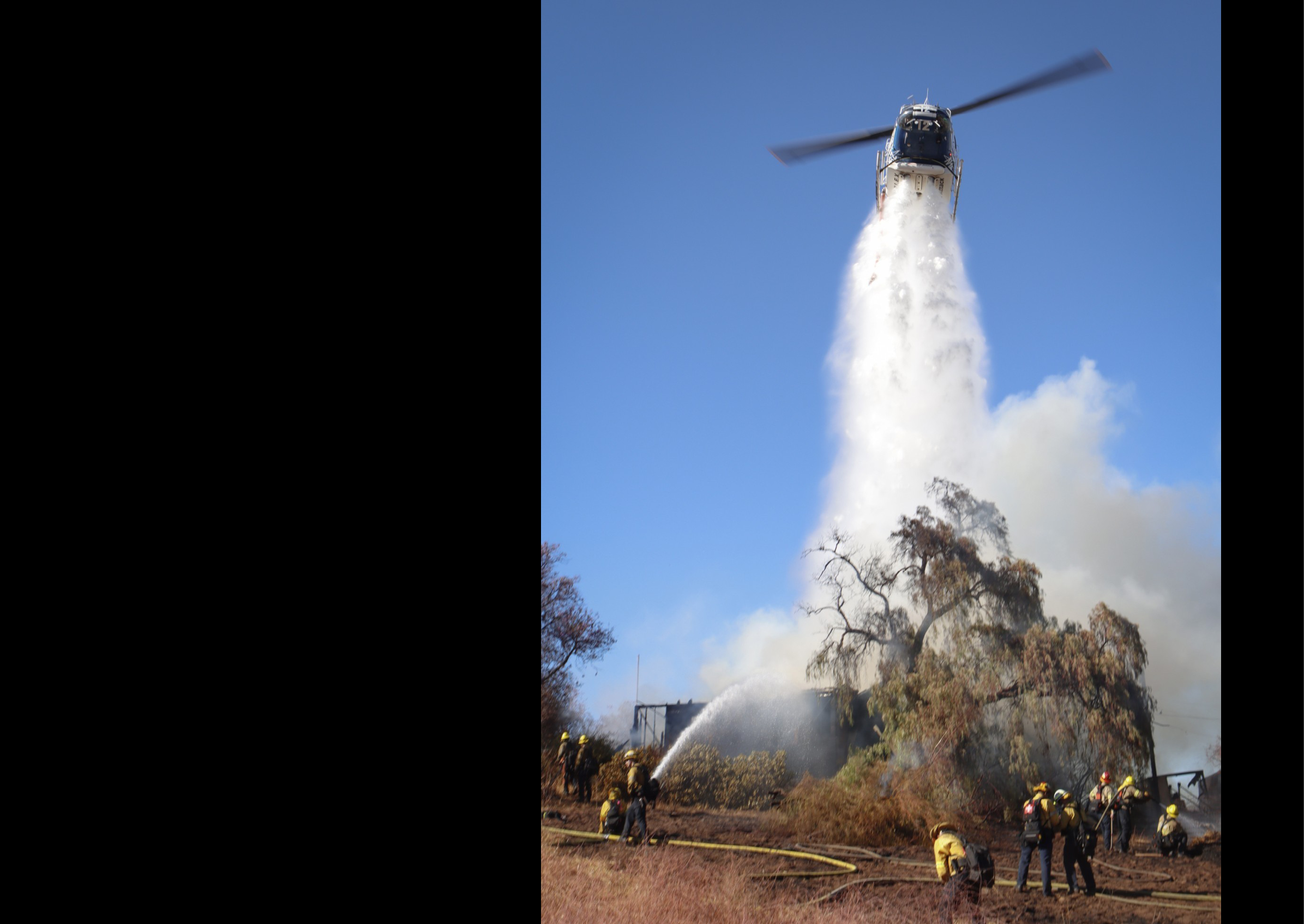 A group of firefighters are working on a fire hydrant, with one of them holding a hose. AI generated content