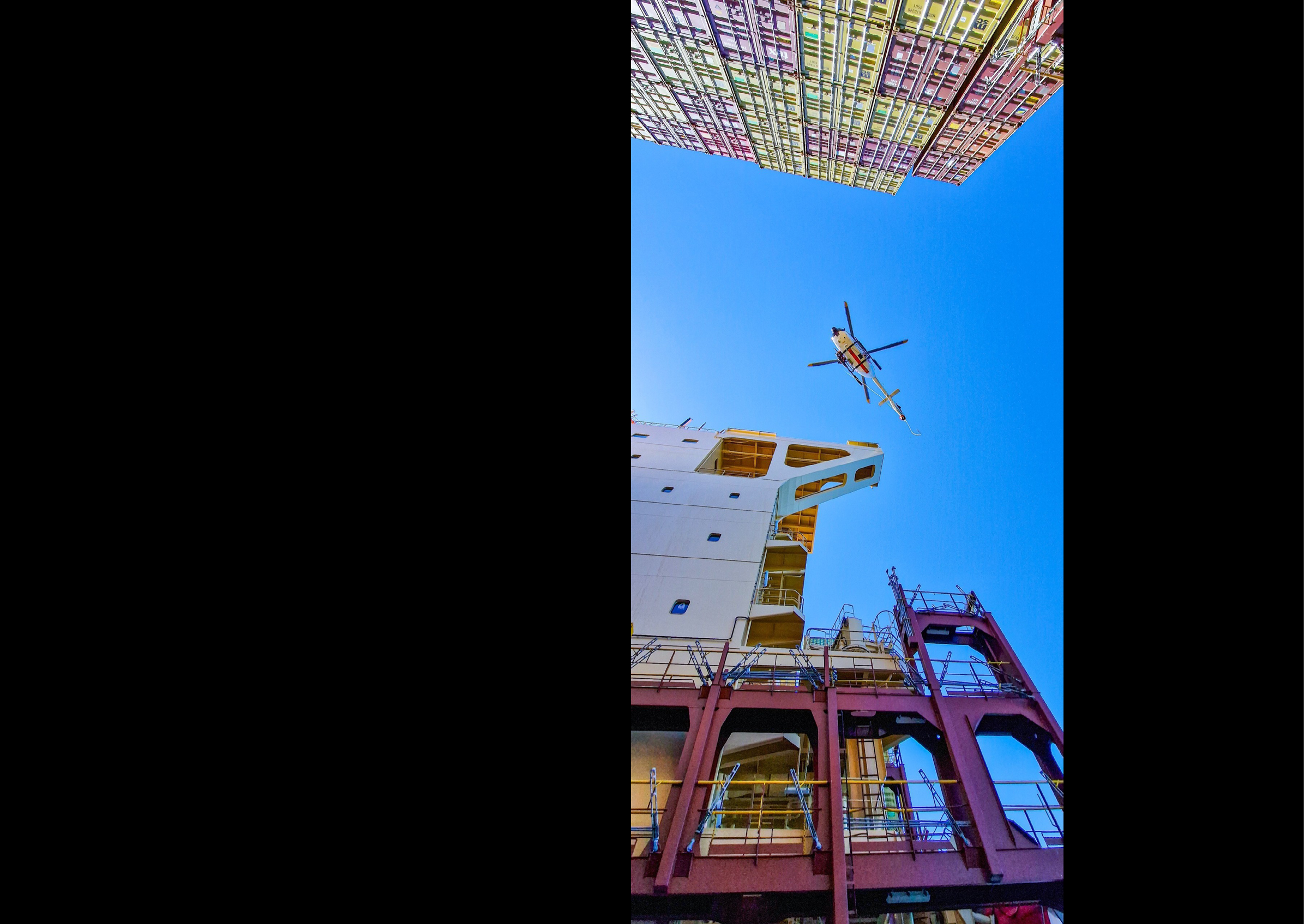 A helicopter is flying above a building, possibly a crane, with a person inside. AI generated content