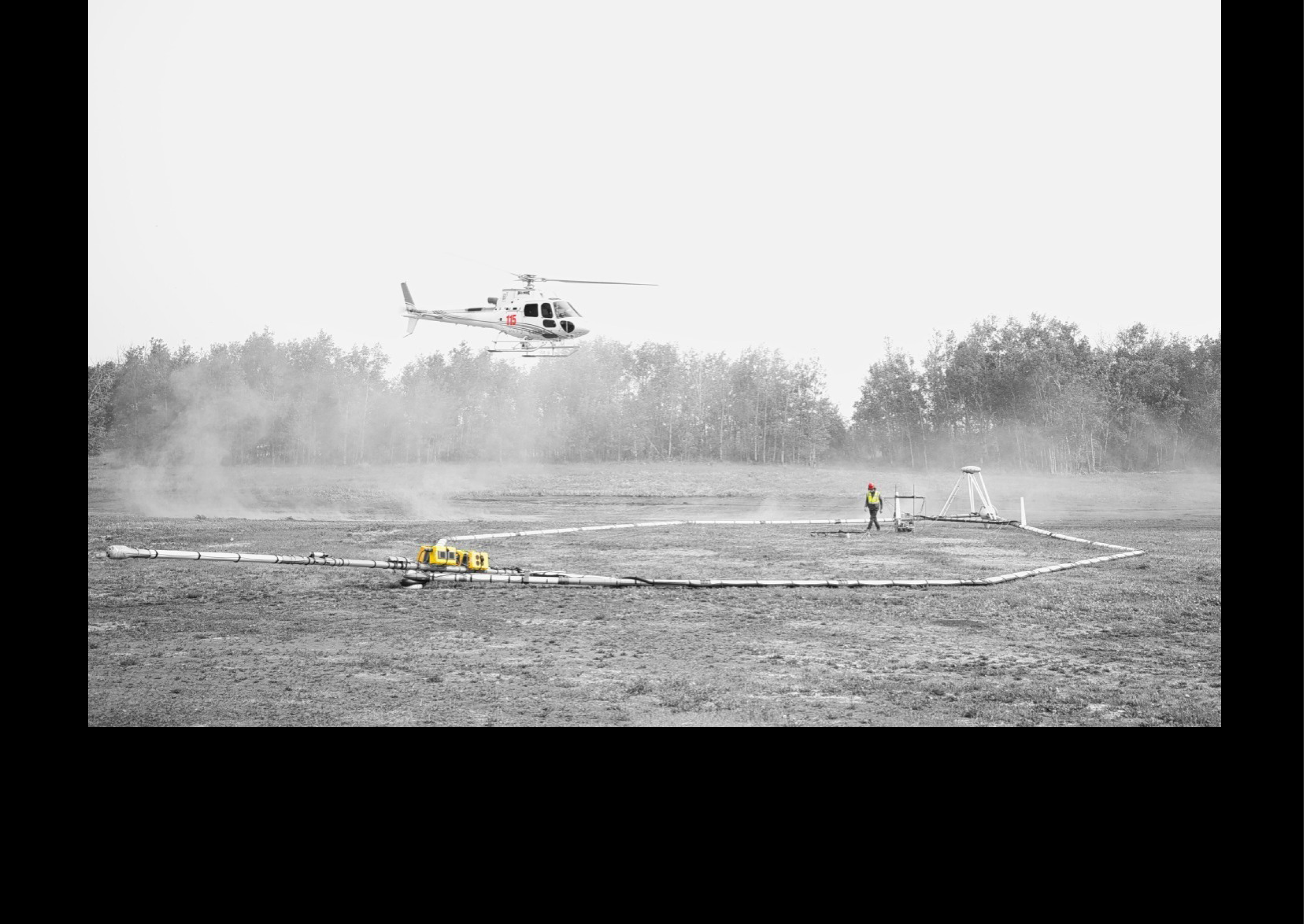 A helicopter is flying over a field with a person standing in it. AI generated content