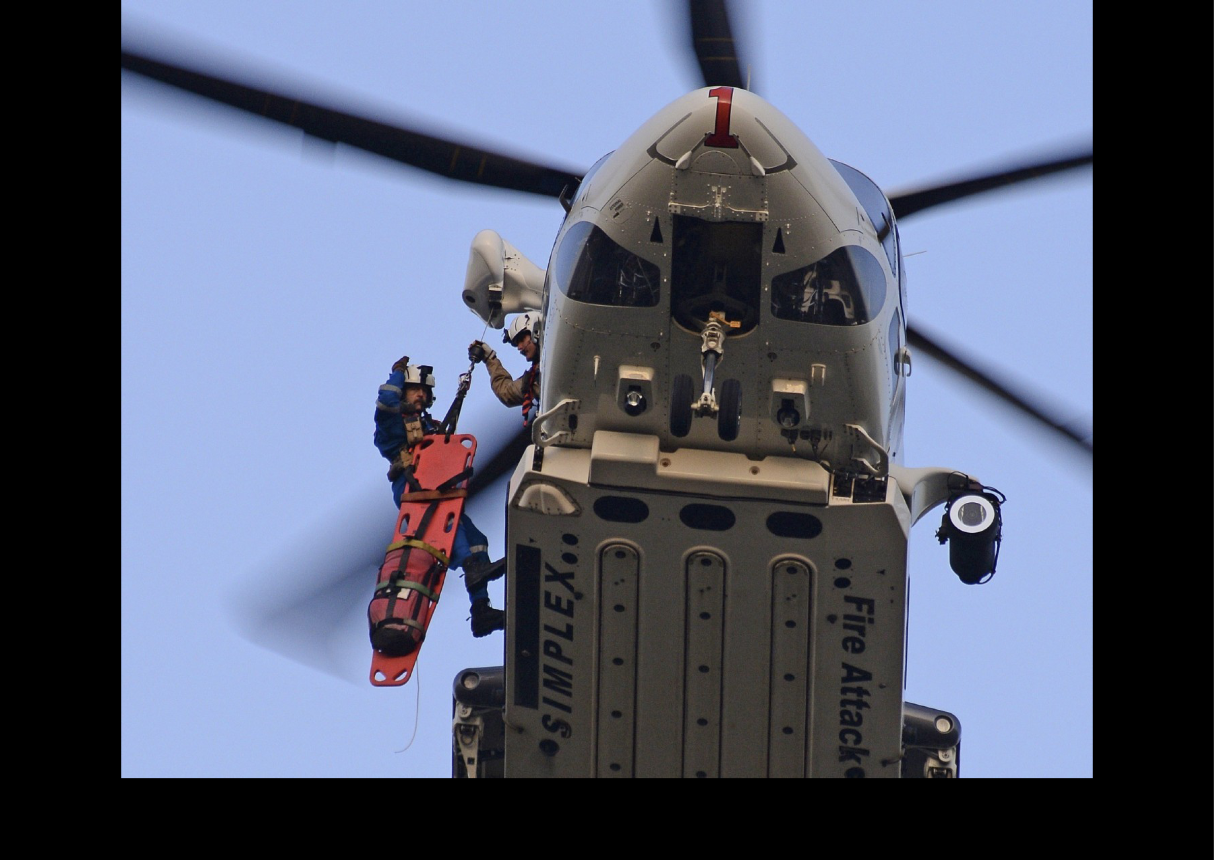 A man is hanging from a helicopter, holding onto a rope. AI generated content