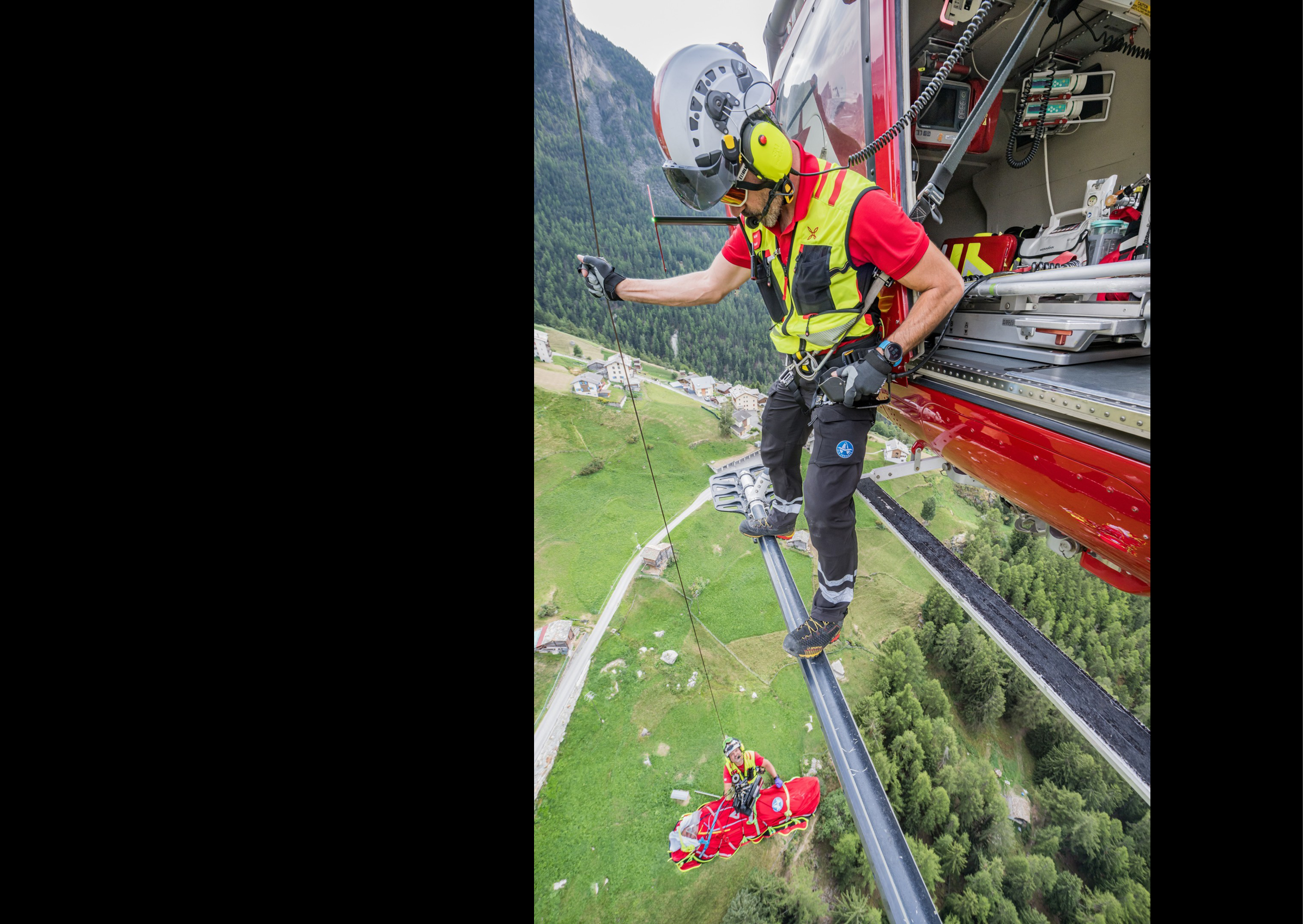 A man in a red shirt is hanging from a wire, holding onto a rope. AI generated content