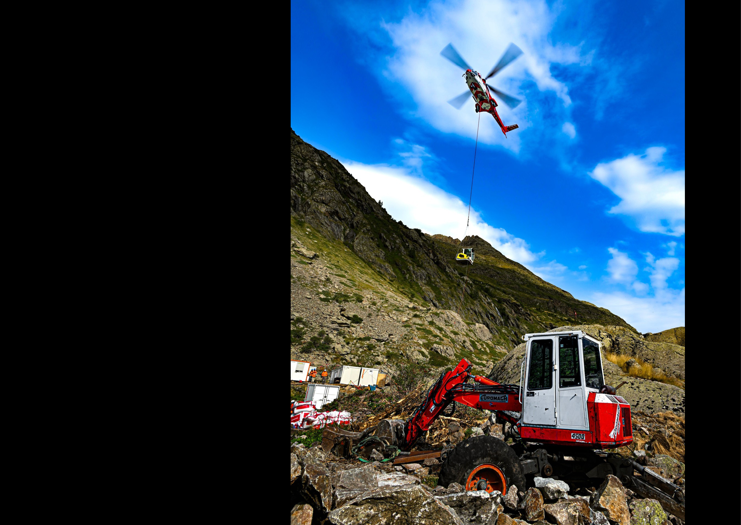 A red helicopter is flying over a red tractor, which is situated on a rocky hillside. AI generated content