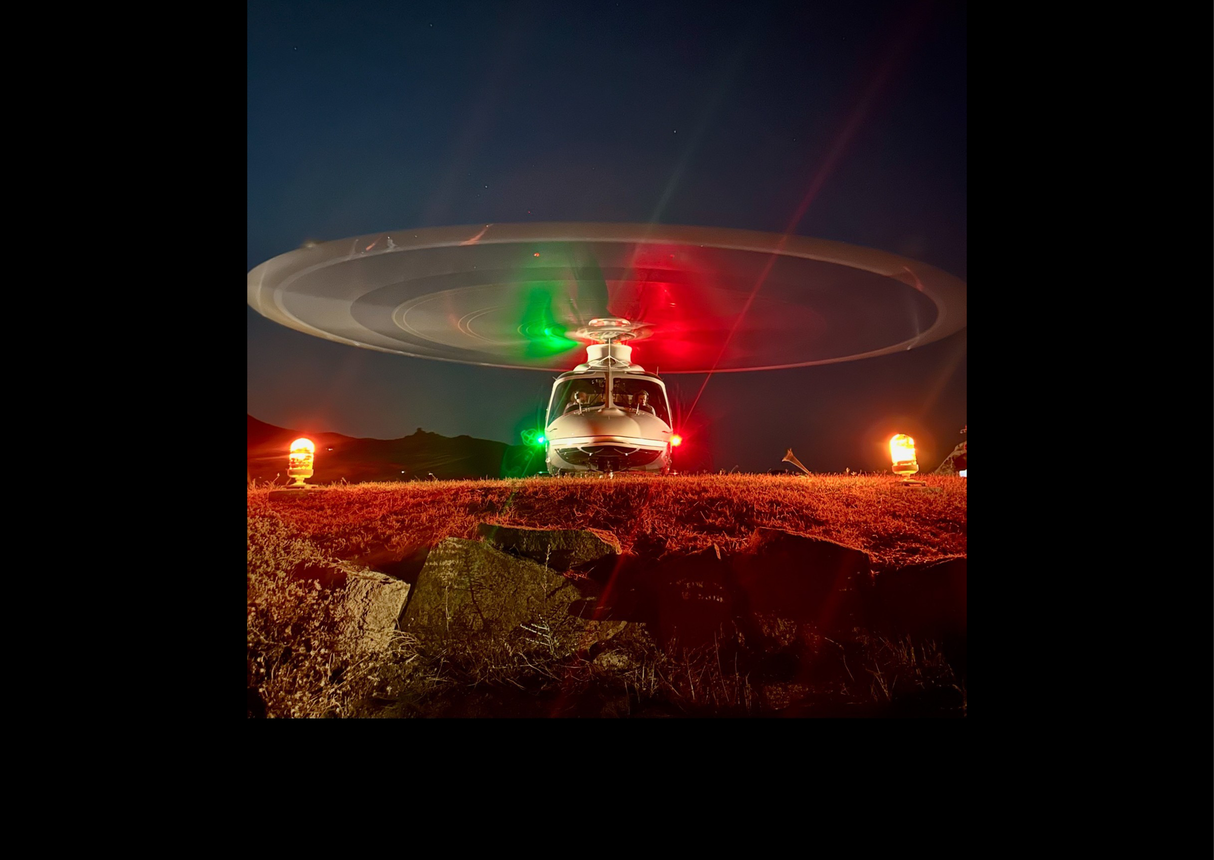 A helicopter with a green and red light on its front is sitting on a rocky hillside. AI generated content