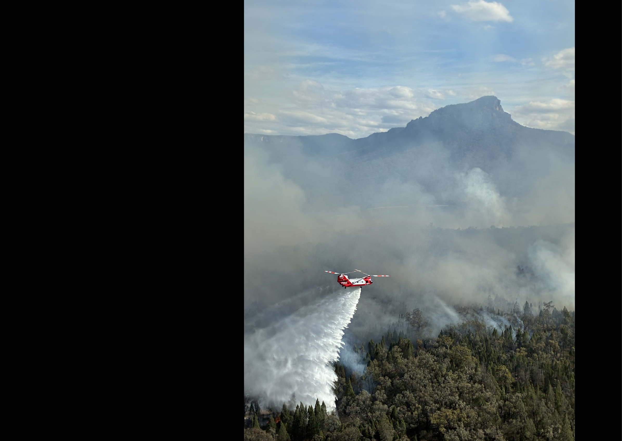 A red and white airplane is flying through the sky, spraying water. AI generated content
