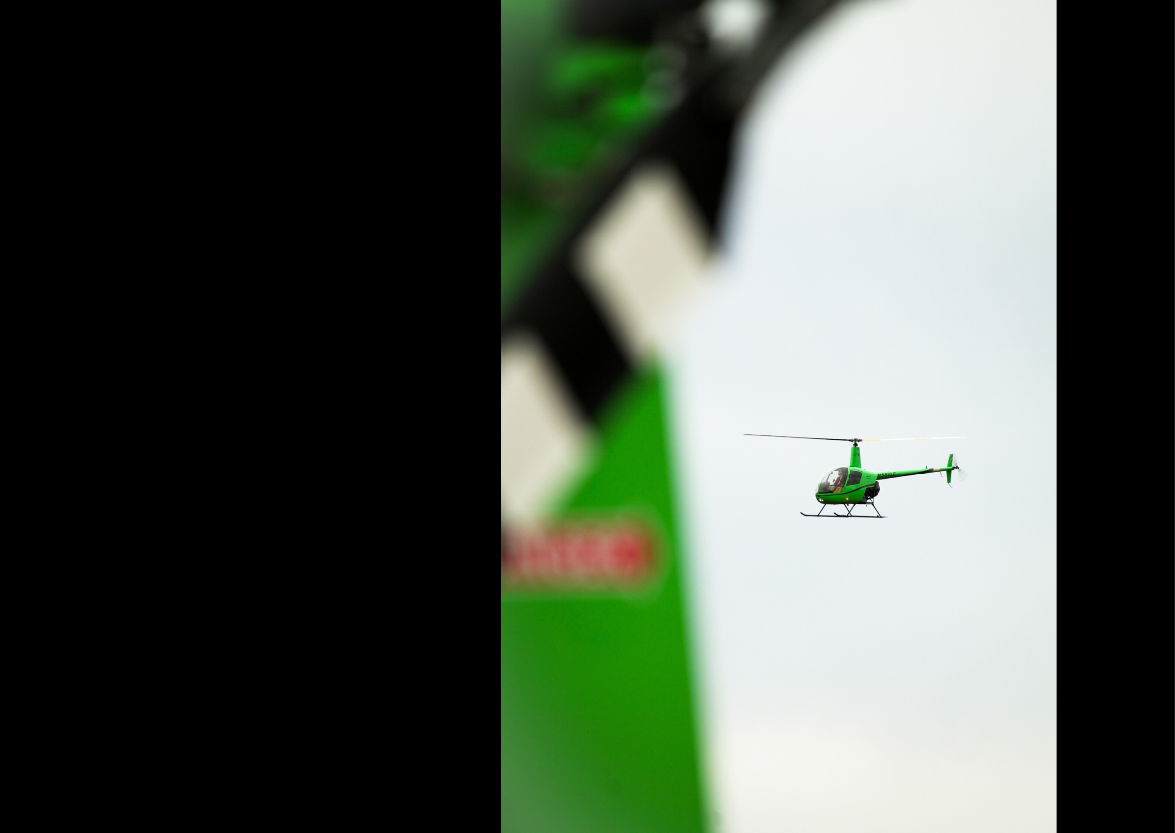 A green helicopter is flying in the air. AI generated content