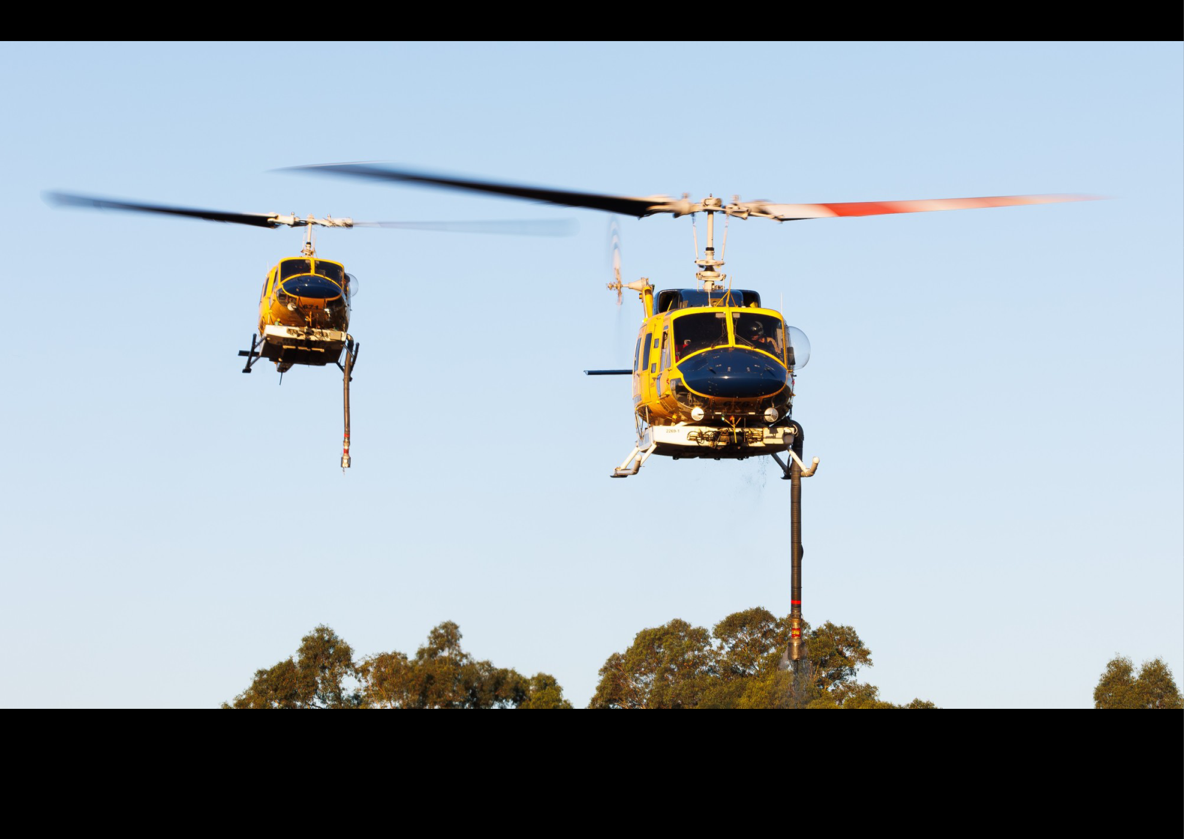 Two helicopters flying in the sky. AI generated content