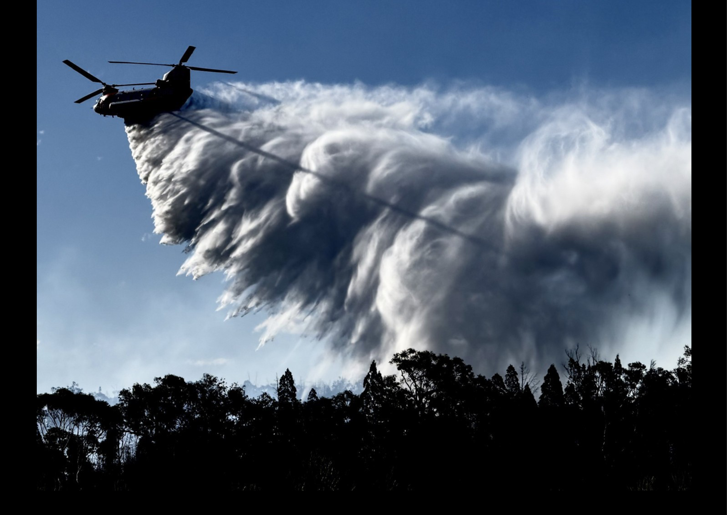 A helicopter is flying through the sky, spraying water. AI generated content
