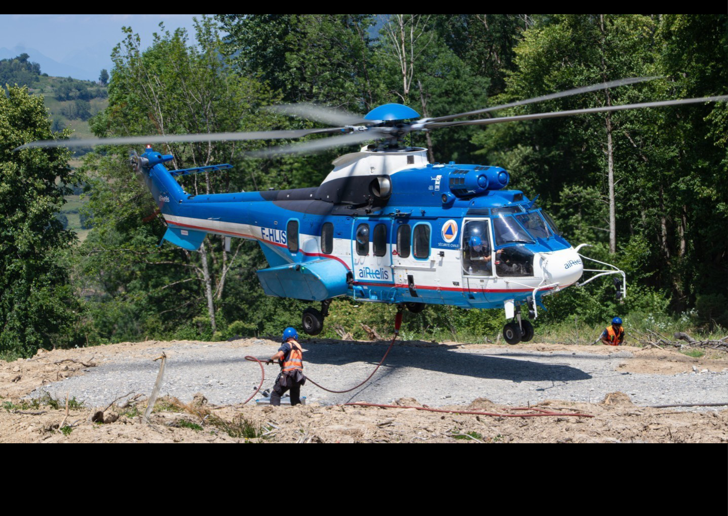 A man is working on a helicopter in a field. AI generated content