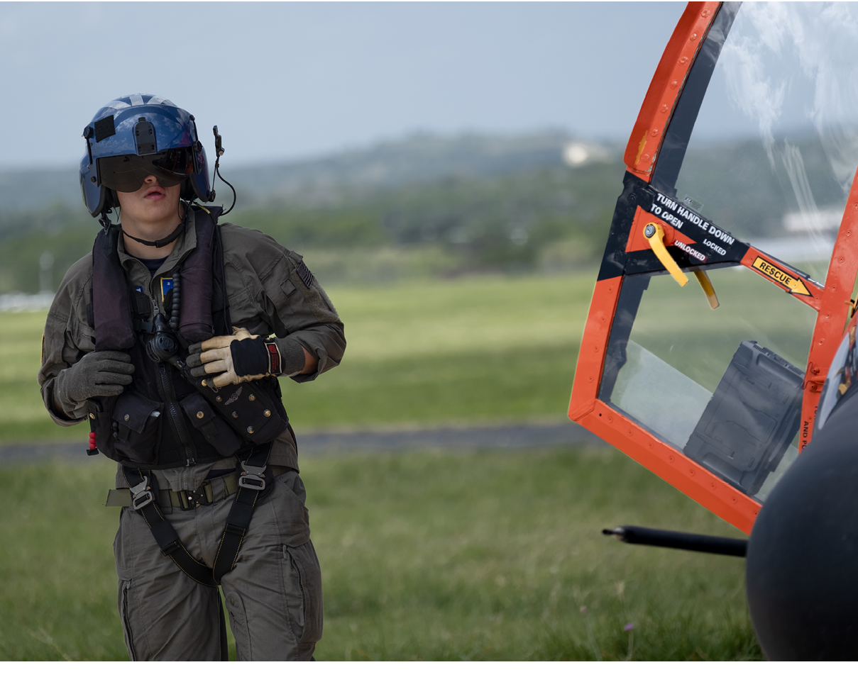U.S. Coast Guard Petty Officer 3rd Class Seth Reeves, an aviation maintenance technician, does pre-flight checks at the Kerrville Airport in Kerrville, Texas, July 6, 2025. Reeves responded to flash flooding in the Texas Hill Country as part of a Coast Guard aircrew conducting search and rescue operations. (U.S. Coast Guard photo by Petty Officer 3rd Class Carmen Caver)