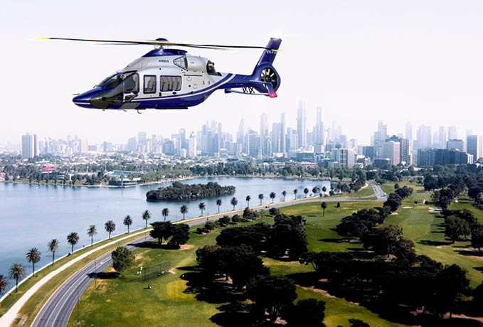 A blue helicopter is flying over a golf course with a city in the background. AI generated content