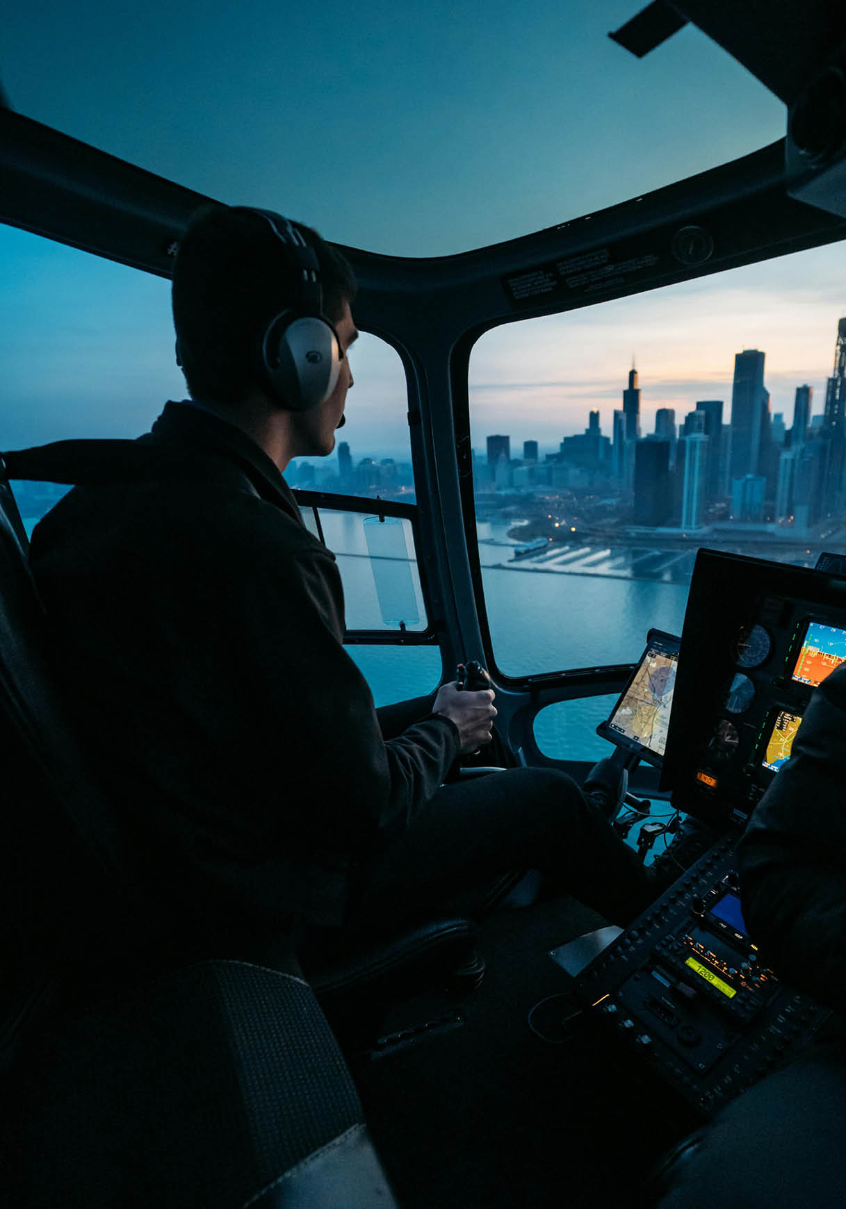 A man is sitting in a helicopter, flying over a city. AI generated content