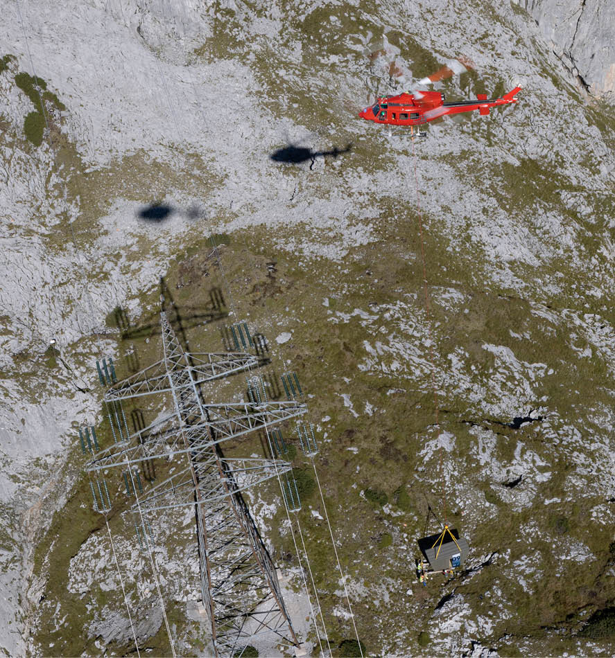 A red helicopter is flying over a rocky hillside. AI generated content