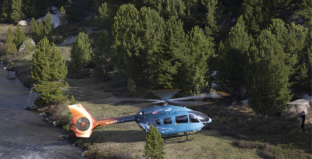 A blue helicopter is parked on a grassy field near a river. AI generated content
