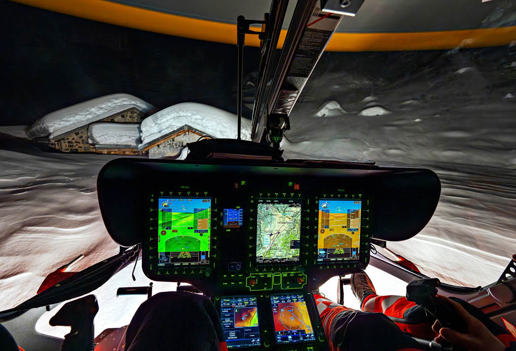 A cockpit of a helicopter with a person in a red and black suit. AI generated content