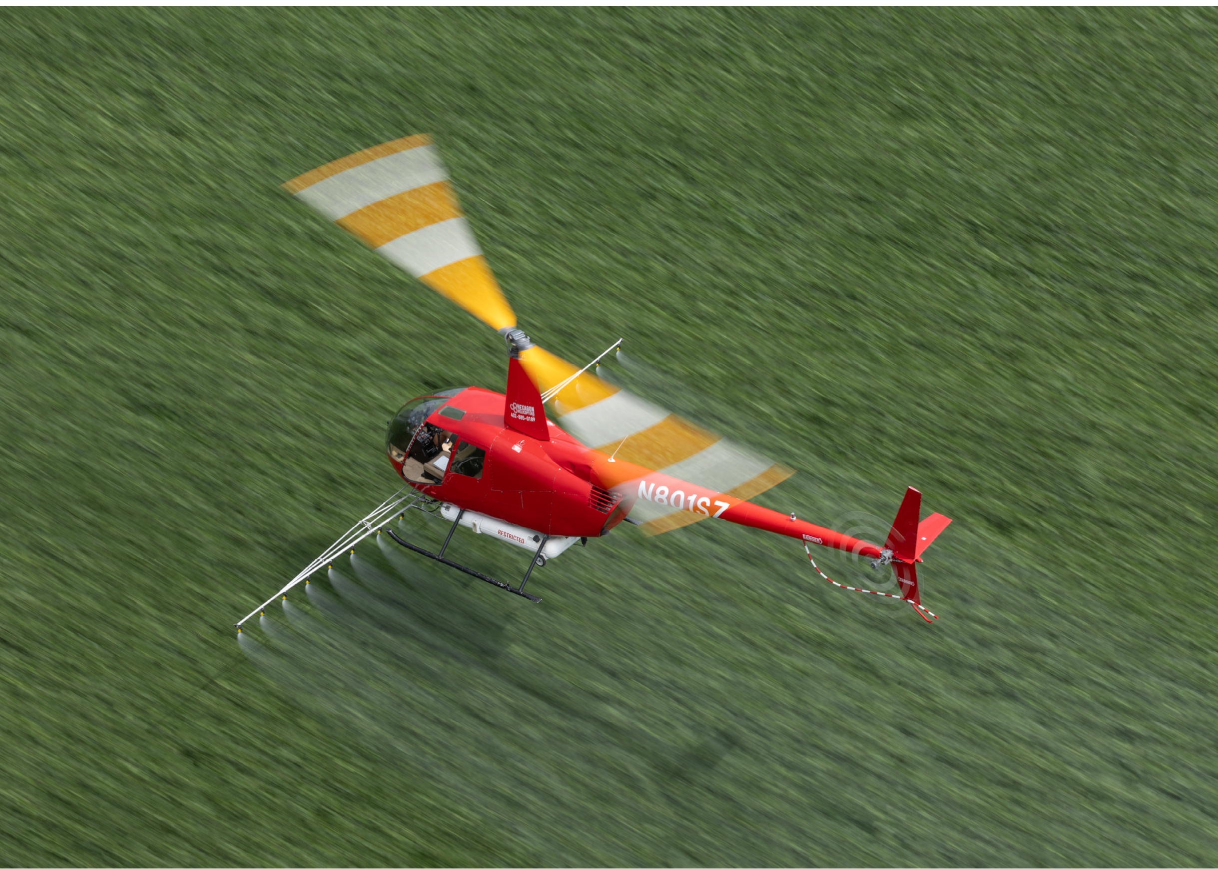 A red helicopter with a yellow stripe is flying in the air. AI generated content
