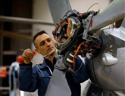 A man in a blue jacket is working on a helicopter. AI generated content