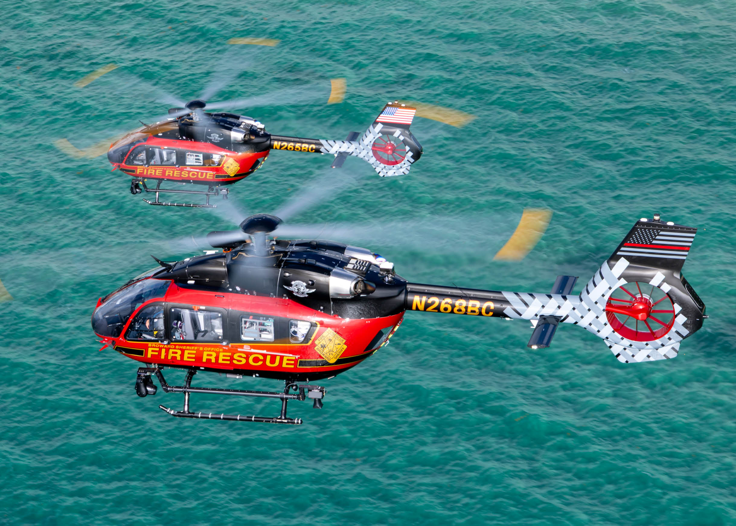 Two helicopters flying over the ocean. AI generated content