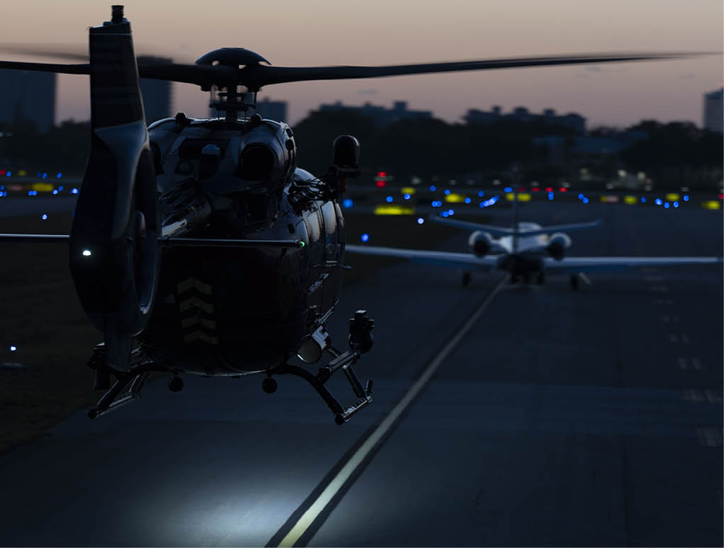 A helicopter is flying on the runway with another helicopter in the background. AI generated content