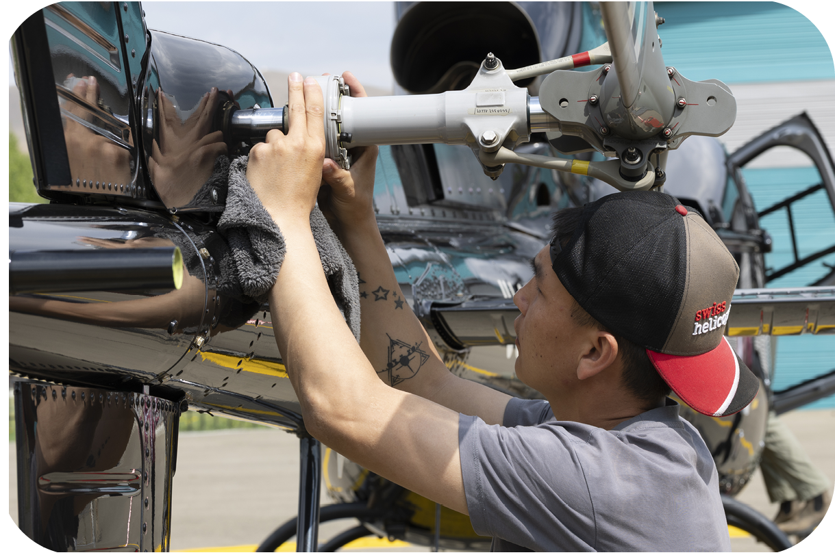 A man is working on a helicopter, fixing the blades. AI generated content
