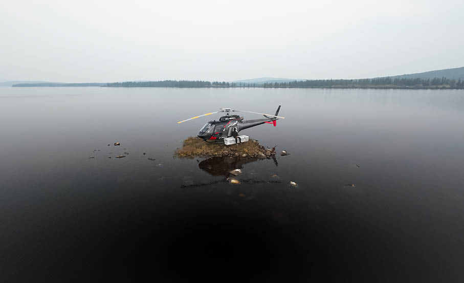 A helicopter is seen sitting on top of a rock in the middle of a lake. AI generated content
