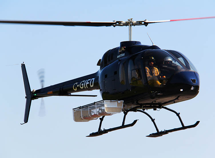 A helicopter with the letters G-GIRA on the side is flying in the sky. AI generated content