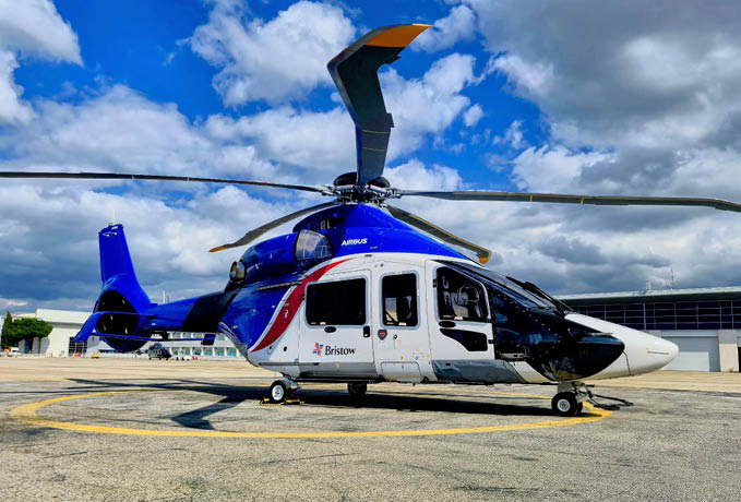 A blue and white helicopter is parked on a runway. AI generated content