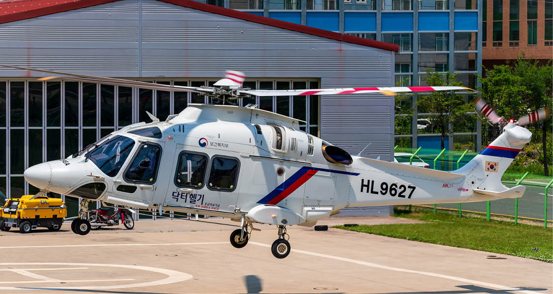 A helicopter with the number 8877 on the tail is on the ground. AI generated content