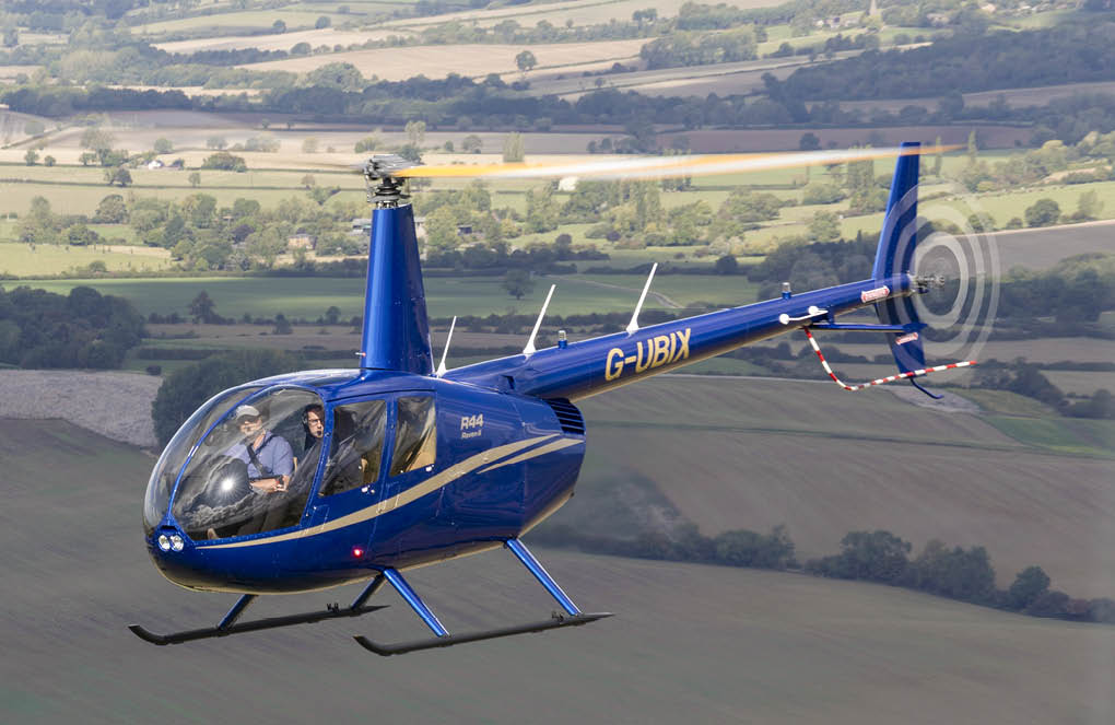 A blue helicopter is flying over a field. AI generated content