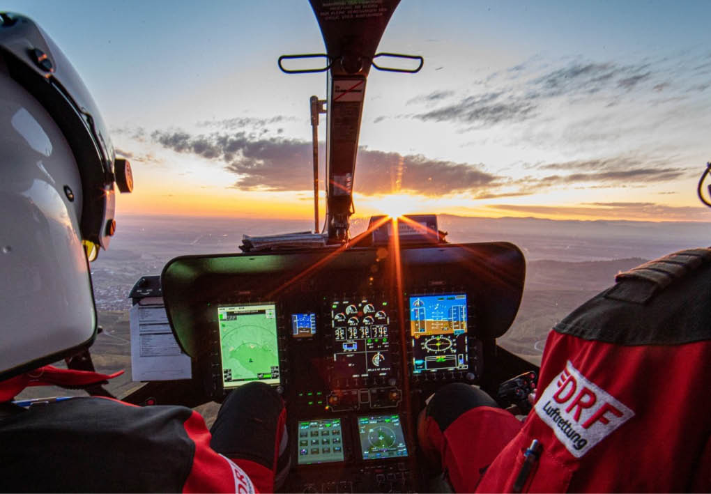 Two people are in a helicopter, one of them is flying the helicopter. AI generated content