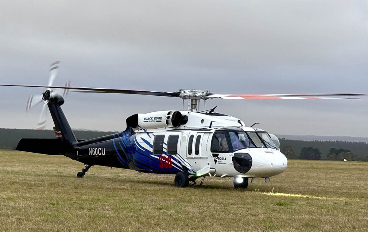 A large helicopter is parked on a grassy field. AI generated content